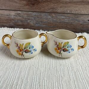 Cream and Sugar Porcelain Set with Gold Leaf Trim and Floral Design